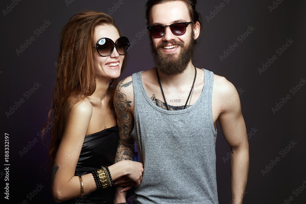 happy smiling beautiful couple in sunglasses happy smiling beautiful couple in sunglasses