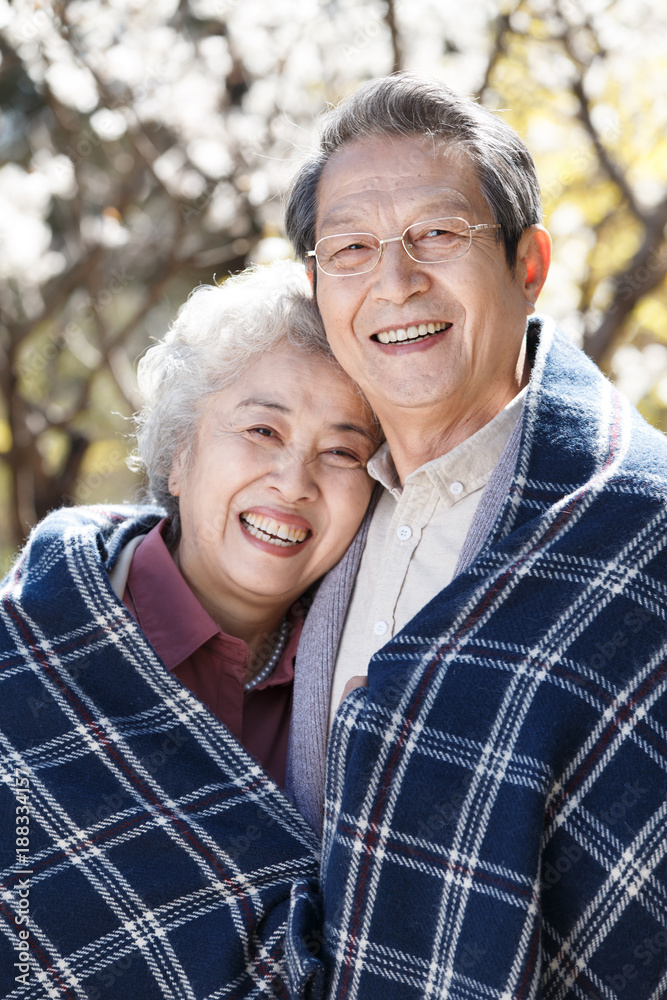 The happy old couple basked in the sun The happy old couple basked in the sun