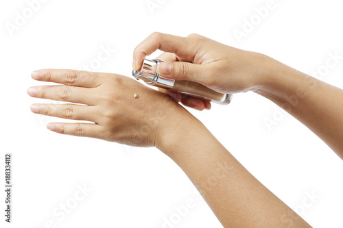 Liquid foundation on woman's hands isolated with clipping path.