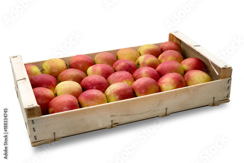 wooden crate with  red and yellow apples  on white background