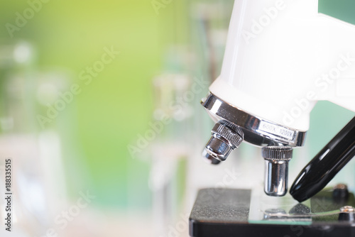 Science laboratory research and development concept. microscope with test tubes