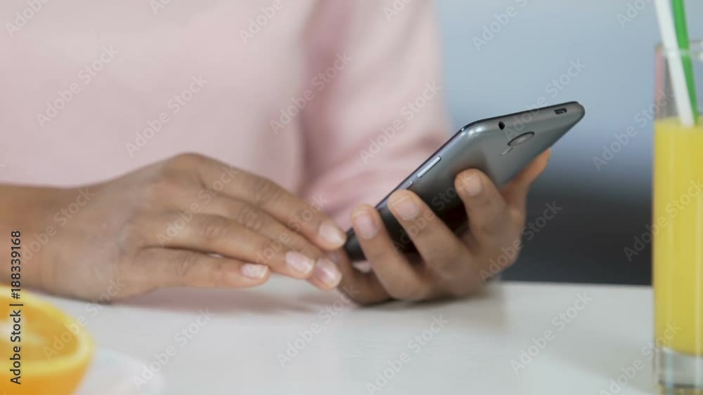 Hands of mixed-race woman surfing on smartphone, online application, technology Hands of mixed-race woman surfing on smartphone, online application, technology