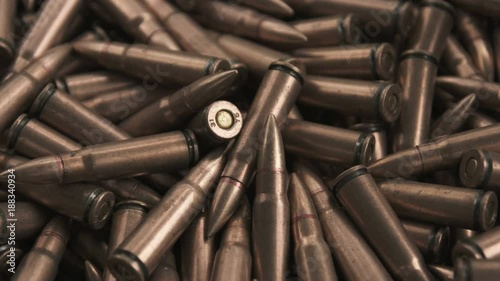 Horizontal panorama of ammunition for ak-47 in color of copper
