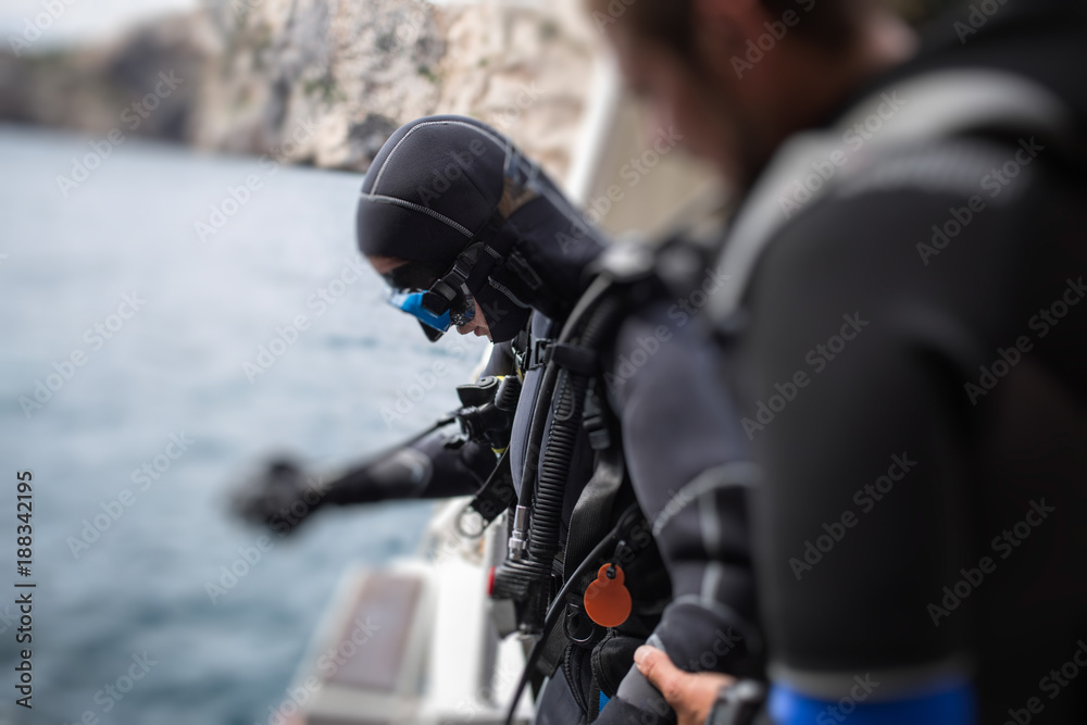 Scuba diver preparing on boat