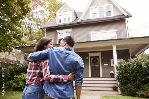 Rear View Of Loving Couple Walking Towards House