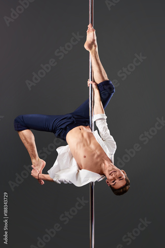 Male pole dancer with stage look posing for fashion magazine cover