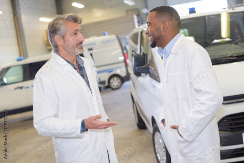 Two ambulance men chatting