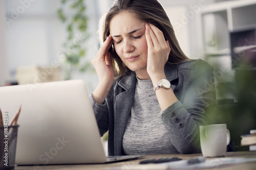 Working woman have a headache