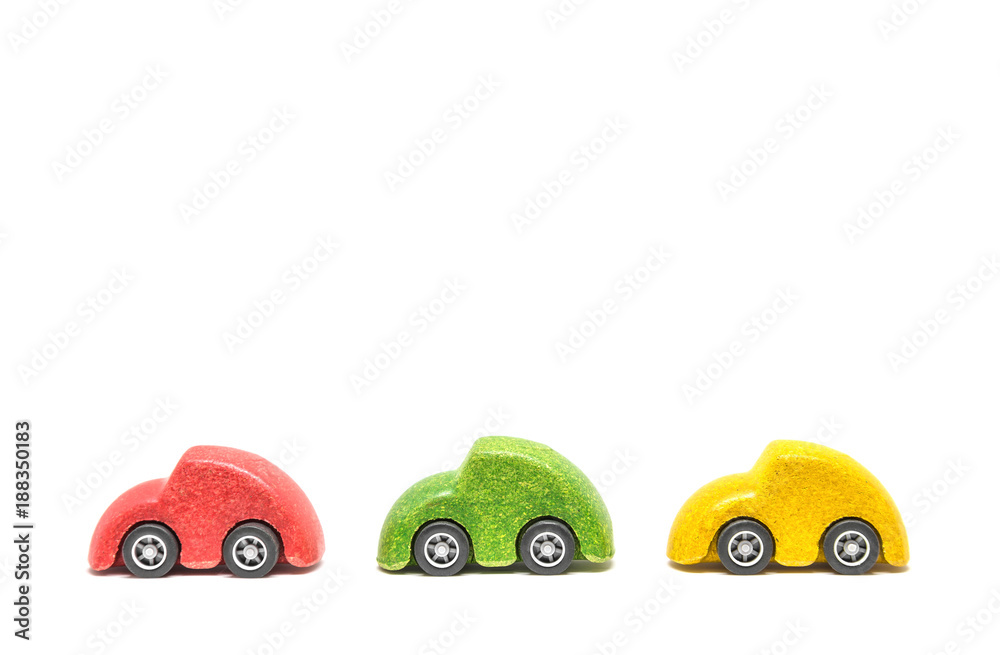 Isolated Colorful wooden car toys in row sequence on white background