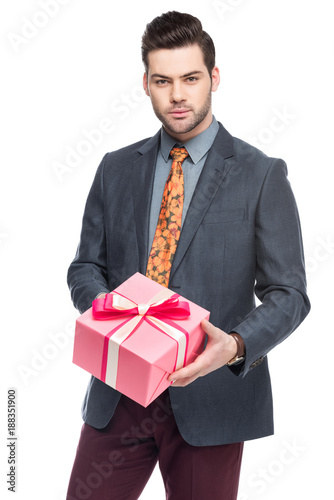 handsome bearded man holding gift box, isolated on white