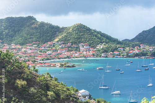 Terre-de-Haut Island in Guadeloupe, panorama of typical houses, the harbor in the bay with sailboats 