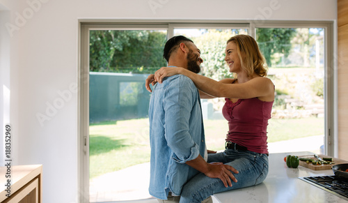 Couple sharing a romantic moment in kitchen
