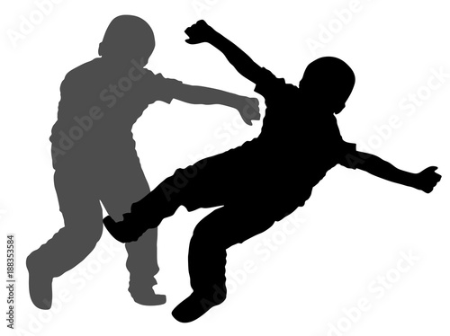 Two boys fighting vector silhouette. Two young brothers fighting vector silhouette illustration. Angry kid terror. Street hitting and punching after school.