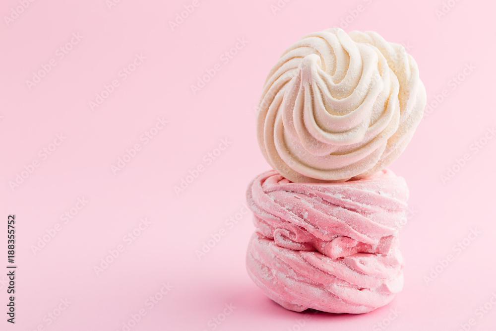 Homemade pink and white zephyr or marshmallow on pink background Homemade pink and white zephyr or marshmallow on pink background