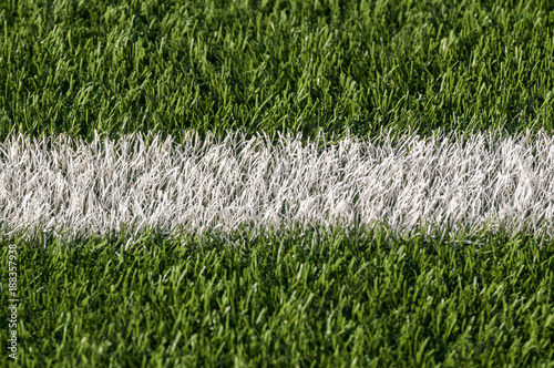 White stripe of astroturf American football field photo