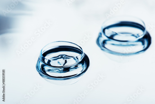 Two contact lenses with reflections