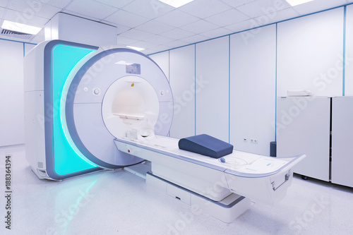Female patient undergoing MRI - Magnetic resonance imaging scan device in Hospital. Medical Equipment and Health Care.. photo