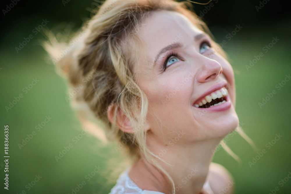 Portrait of charming smiling bride standing in the park Portrait of charming smiling bride standing in the park