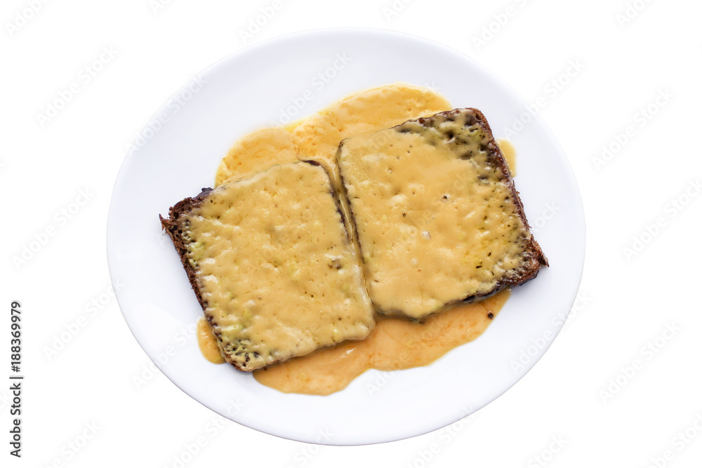 Disgusting sandwiches lying on a white plate. Unhealthy breakfast.