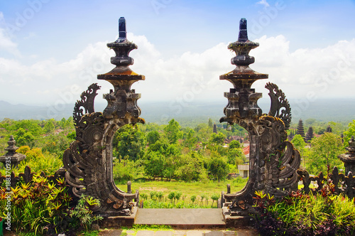 View to Bali island landscape from huge stone gate of Mother Temple Pura Besakih, Balinese largest Hindu temple and most famous place of worship.