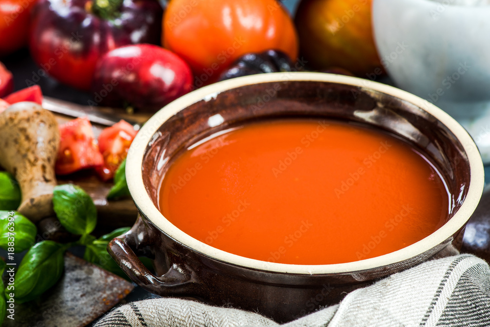 Rustic pot with creamy tomato soup Rustic pot with creamy tomato soup