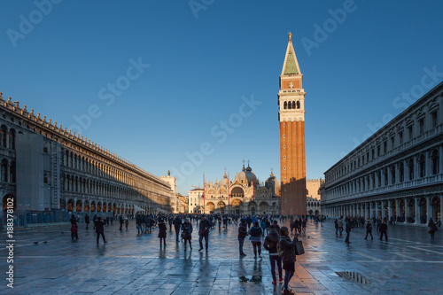 VENICE, ITALY - JANUARY 02 2018: San Marco square with cathedral and bell tower shadow at evening time