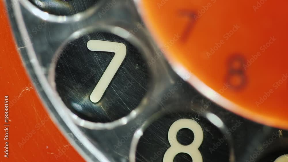Dial the number on the old disk phone. Close-up, digit 7