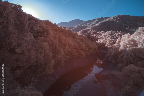 surreal lake dam in infrared colors