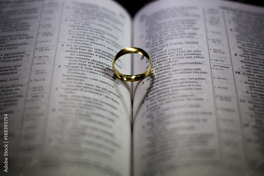 Fototapeta premium Heart-shaped shadow on Bible
