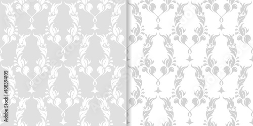 Light gray floral ornaments. Set of seamless patterns