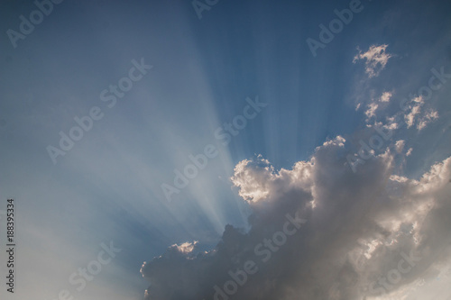 Light in blue sky with some clouds