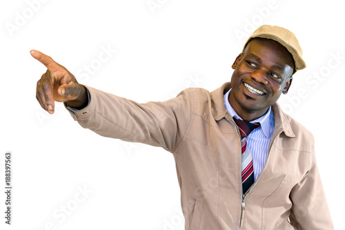 Young smiling african man pointing with finger at corner.