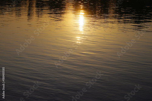 water surface with reflection of the sun