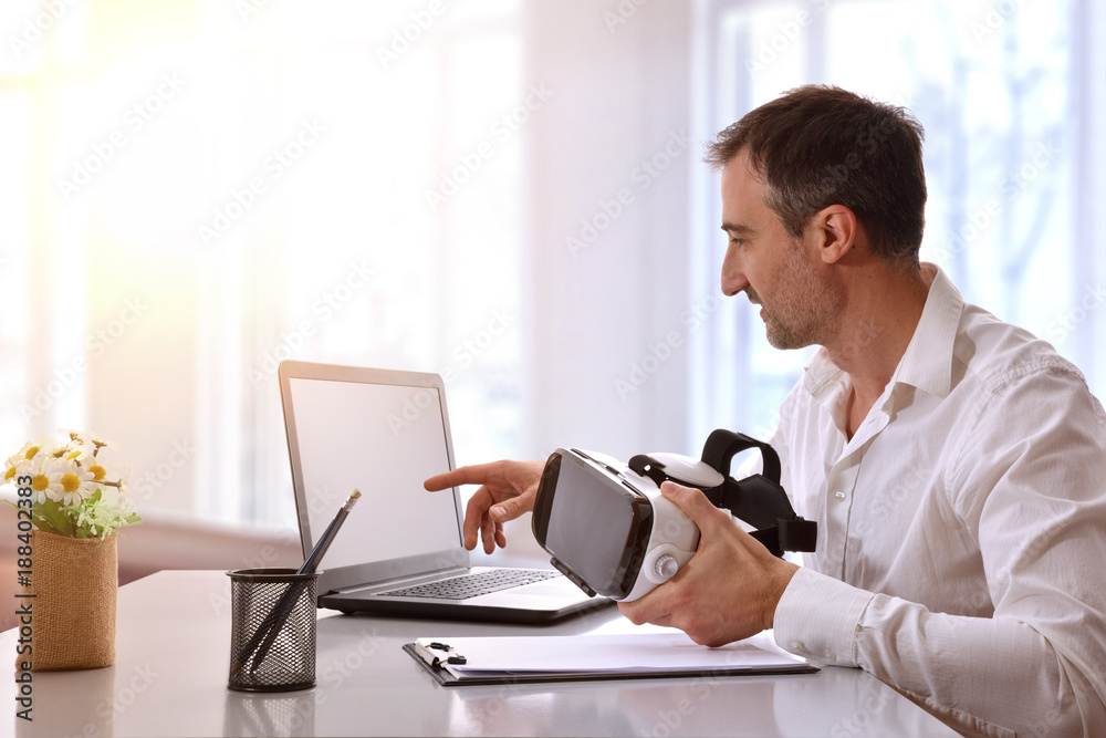 Office worker working with virtual reality glasses in the office Office worker working with virtual reality glasses in the office