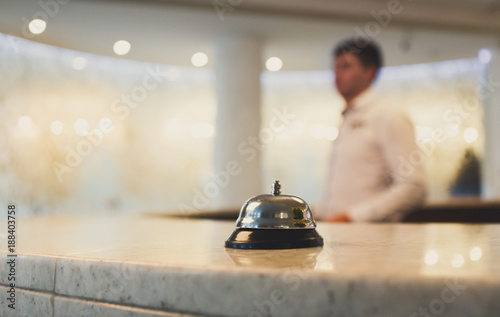 Fotografie Hotel accommodation call bell on reception desk