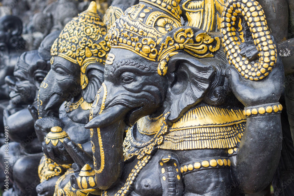 Sculptures of hindu god Ganesha in the traditional art market of Ubud, Bali