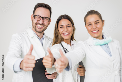 Portrait of three happy doc...