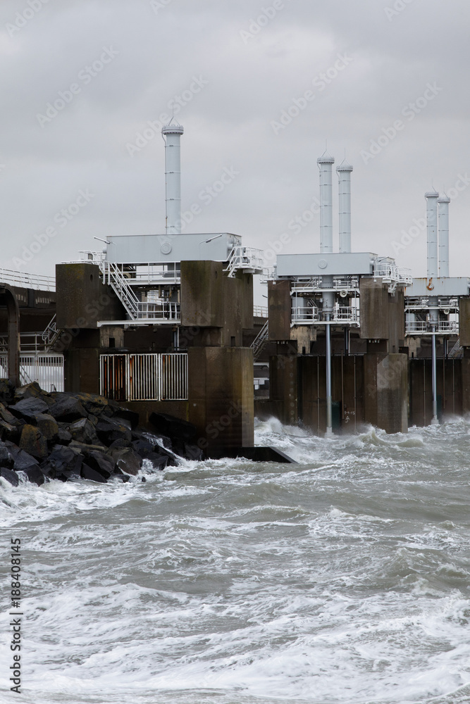 Obraz premium The storm surge barrier Oosterschelde closed for high tide with storm