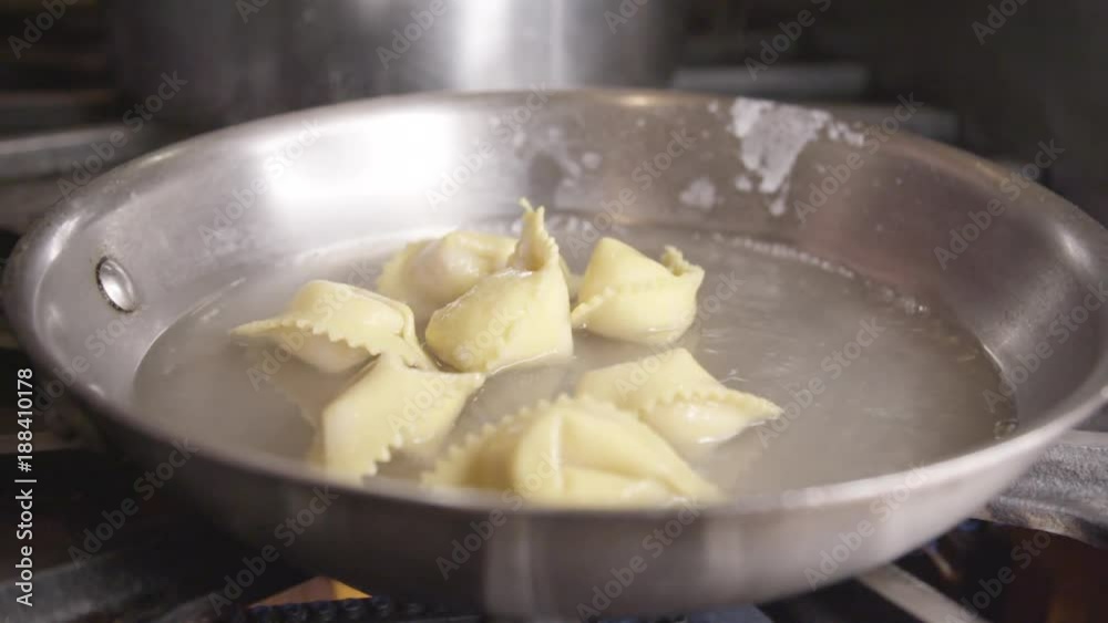 Slow motion, ravioli cooks in pan Slow motion, ravioli cooks in pan