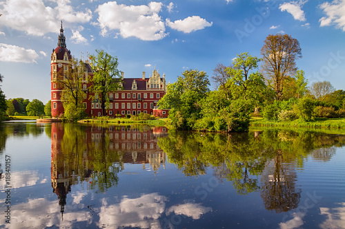 Beautiful view on Park Bad Muskau with reflection in the lake at springtime, Saxony, Germany.