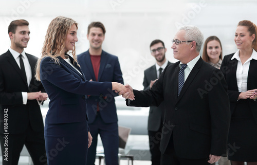 handshake serious businessman and business woman