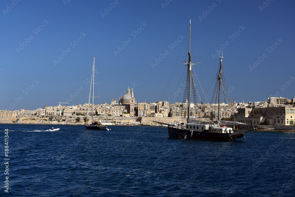Maltese capital Valletta seen from the see. Serene afternoon in the bay of Sliema Maltese capital Valletta seen from the see. Serene afternoon in the bay of Sliema