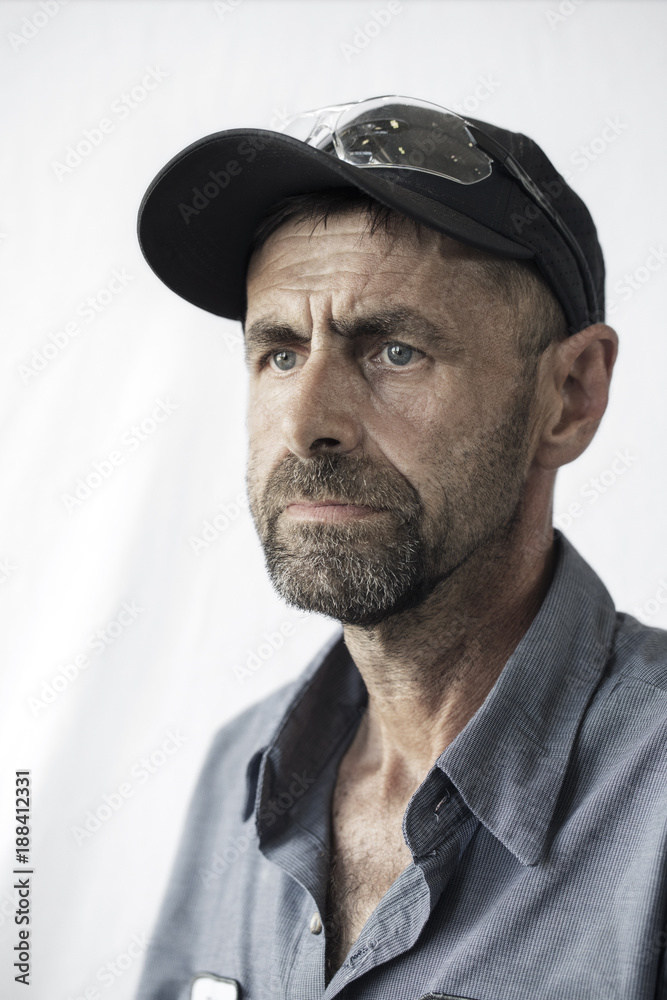 Worker standing against white background Worker standing against white background