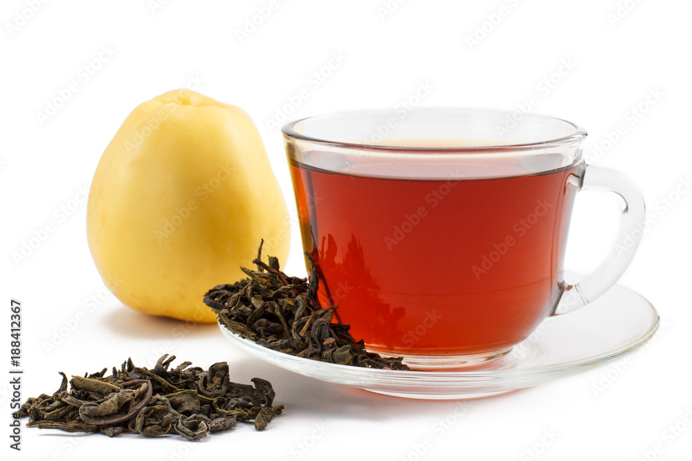 Glass cup of tea on saucer with dry leaves of green tea and apple on white isolated background Glass cup of tea on saucer with dry leaves of green tea and apple on white isolated background