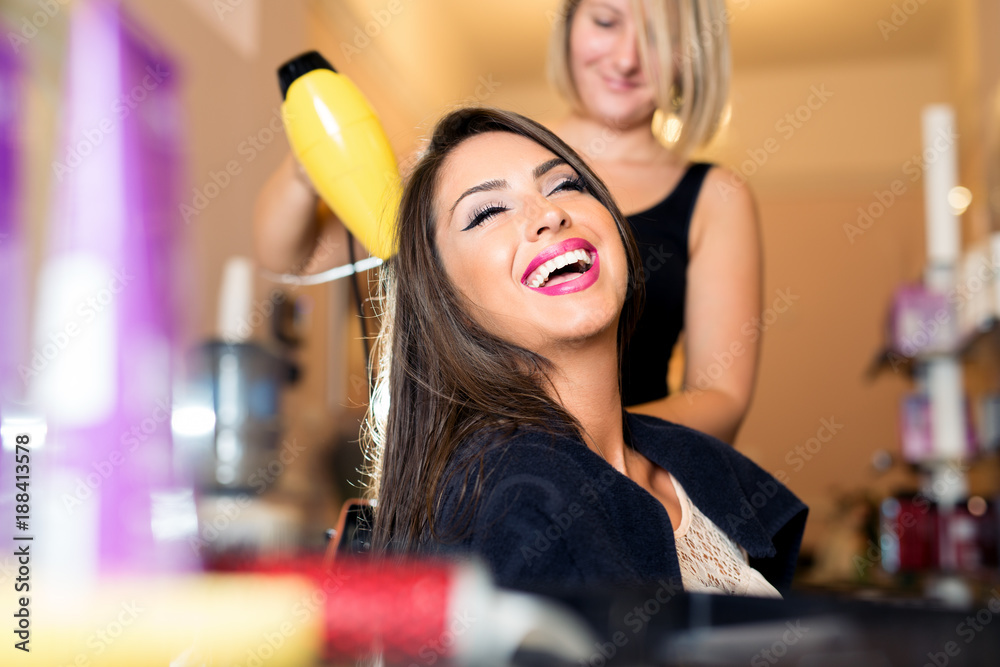 Portrait of a happy woman at the hair salon - obrazy, fototapety, plakaty 