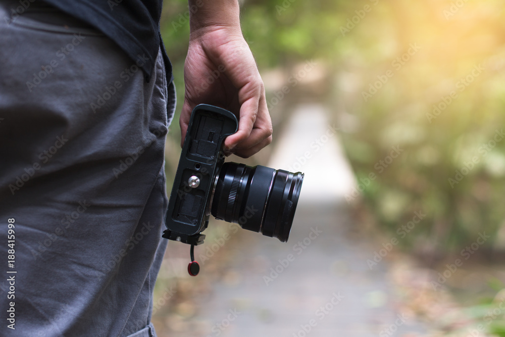 male photographer, hand hold camera, outdoor male photographer, hand hold camera, outdoor