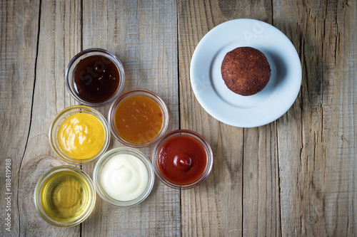 a variety of sauces and meatballs from chickpeas