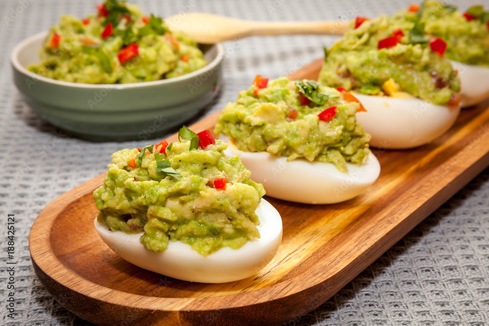 eggs stuffed with guacamole with coriander and chili eggs stuffed with guacamole with coriander and chili