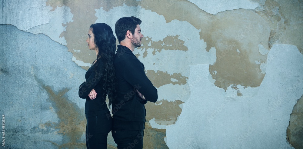 Composite image of profile view of sad couple standing back to