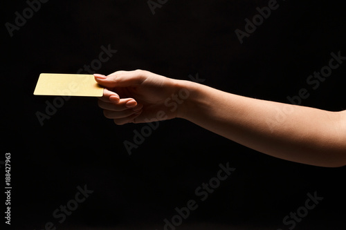 Closeup of female hand holding blank plastic card
